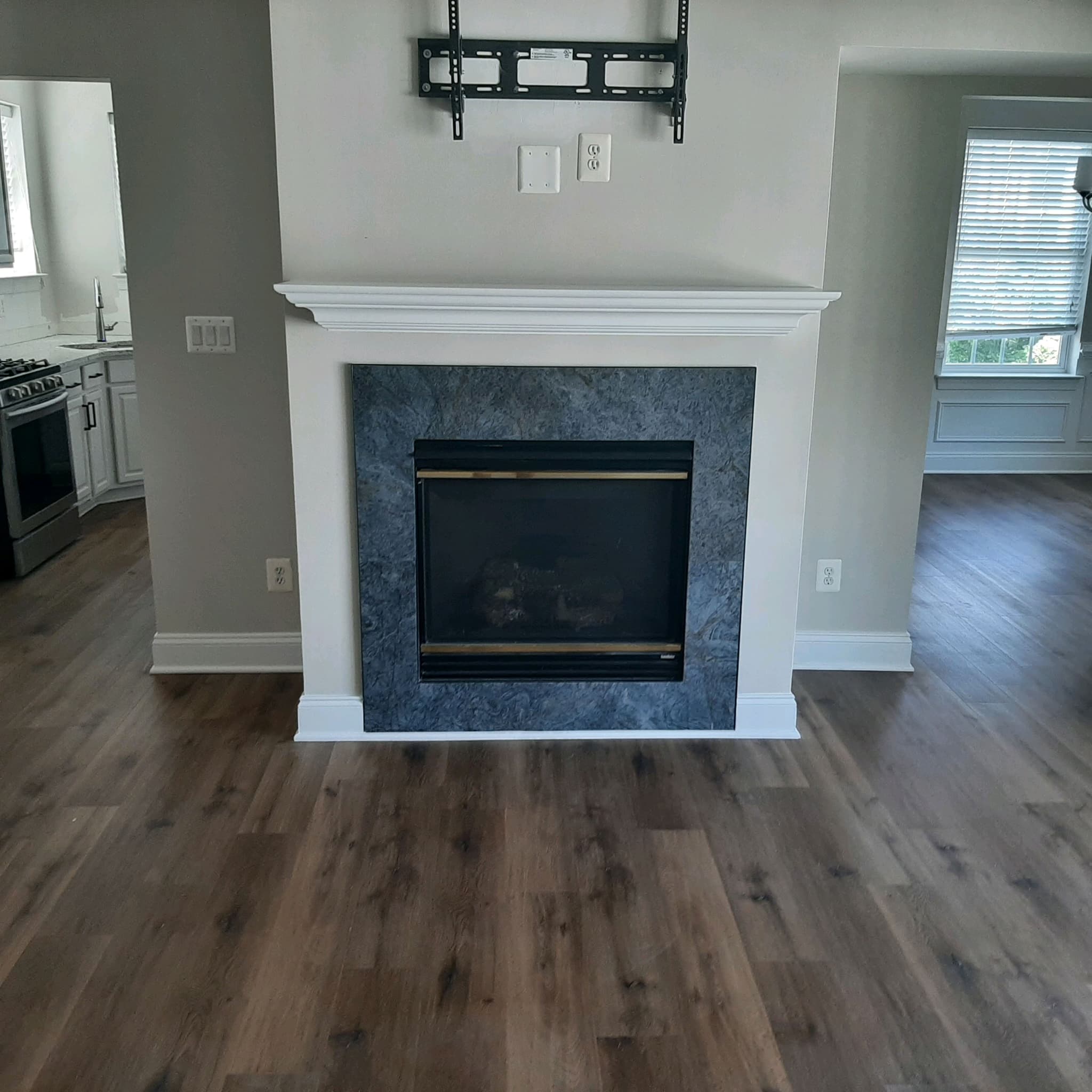 Fireplace with Polished Dark Wood Floor